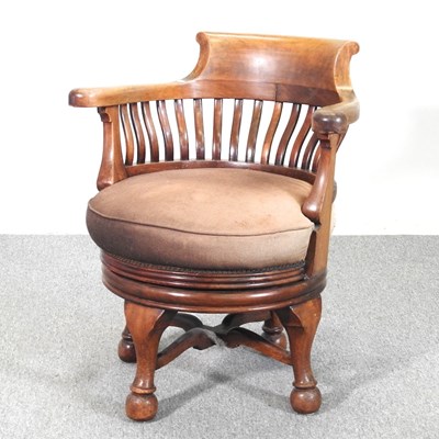 Lot 258 - An Edwardian revolving desk chair, on cabriole...