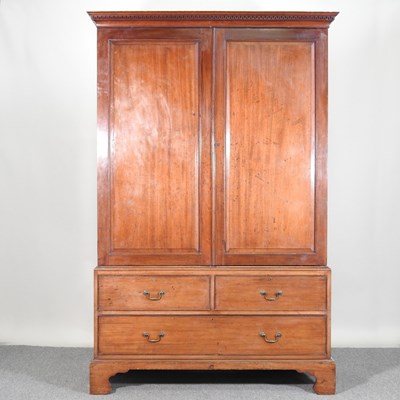 Lot 702 - A George III mahogany linen press, fitted with...