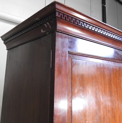 Lot 702 - A George III mahogany linen press, fitted with...
