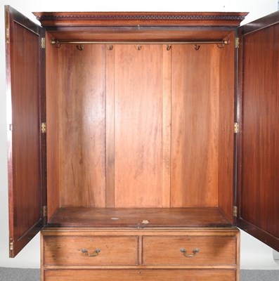 Lot 702 - A George III mahogany linen press, fitted with...