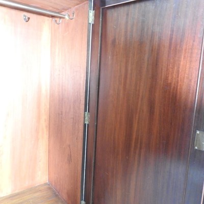 Lot 702 - A George III mahogany linen press, fitted with...