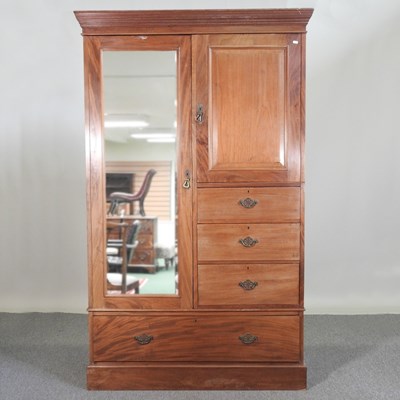 Lot 511 - An Edwardian mahogany combination wardrobe, on...