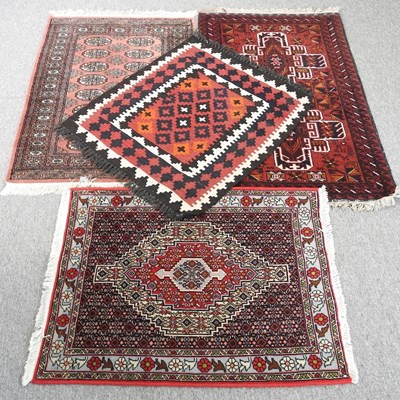 Lot 675 - A Persian rug, with a hooked central medallion,...