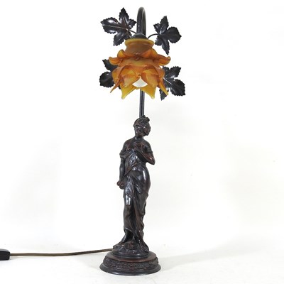 Lot 151 - A bronzed figural table lamp, with a frilled...