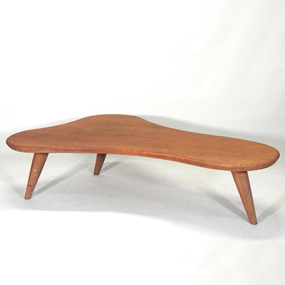 Lot 804 - A 1970's teak coffee table, of organic shape,...