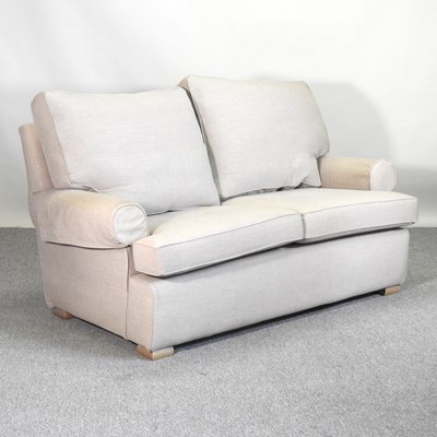 Lot 755 - A Multiyork cream upholstered two seater sofa