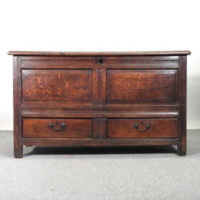 Lot 756 - An 18th century oak mule chest, the hinged lid...