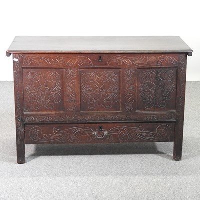 Lot 314 - An 19th century carved oak mule chest, with a...