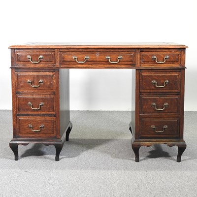 Lot 271 - An early 20th century oak pedestal desk, with...