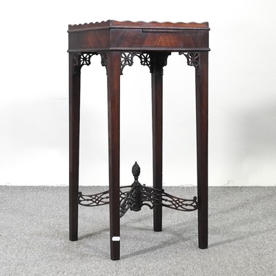 Lot 350 - An Edwardian mahogany urn table, with fret...