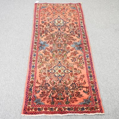 Lot 353 - A Persian runner, with floral designs, on a...