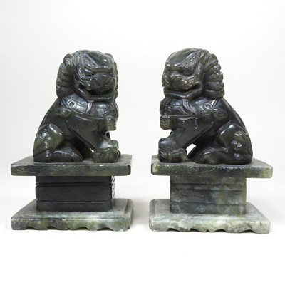 Lot 107 - A pair of Chinese carved soapstone models of...