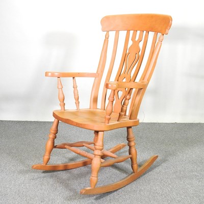 Lot 643 - A modern beech rocking chair