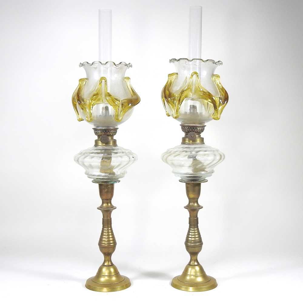 Lot 207 - A pair of brass oil lamps, with frilled