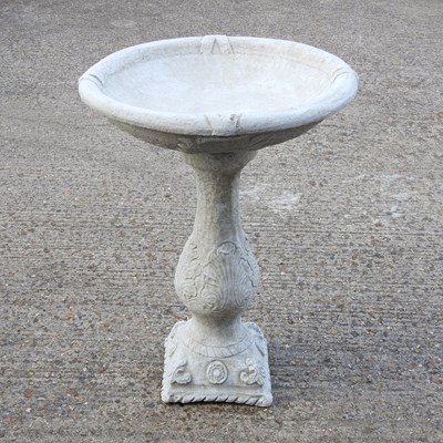 Lot 410 - A cast stone bird bath, 78cm high