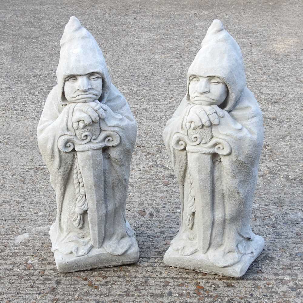 Lot 591 - A pair of cast stone garden gargoyles, 68cm...