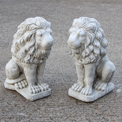 Lot 401 - A pair of cast stone garden statues of seated...