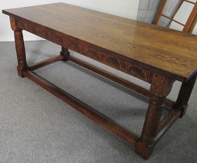 Lot 579 - A handmade oak refectory dining table, on...