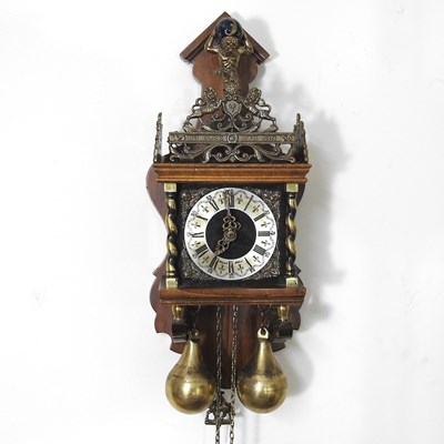 Lot 447 - A Dutch wall clock, with brass weights, 48cm long