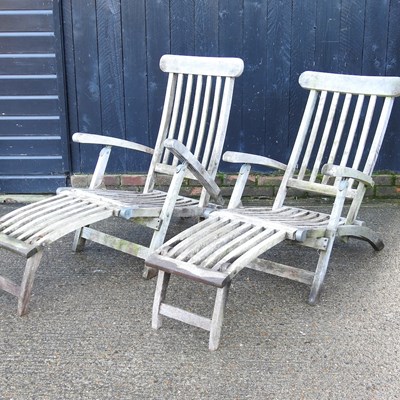 Lot 408 - A pair of teak folding steamer chairs (2)