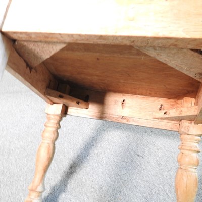 Lot 717 - A pine extending dining table, together with a...