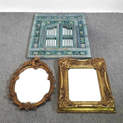 Lot 562 - A carved and green painted mirror, with...