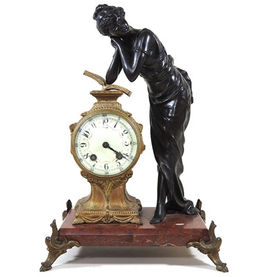 Lot 6 - An early 20th century French figural mantel...