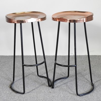 Lot 519 - A pair of black painted metal bar stools, with...