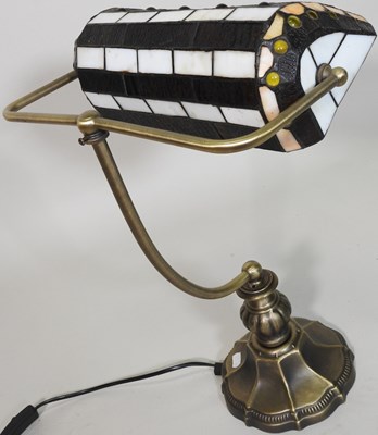 Lot 7 - A Tiffany style desk lamp, with a stained...