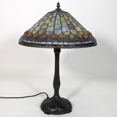 Lot 382 - A Tiffany style metal table lamp, with a...