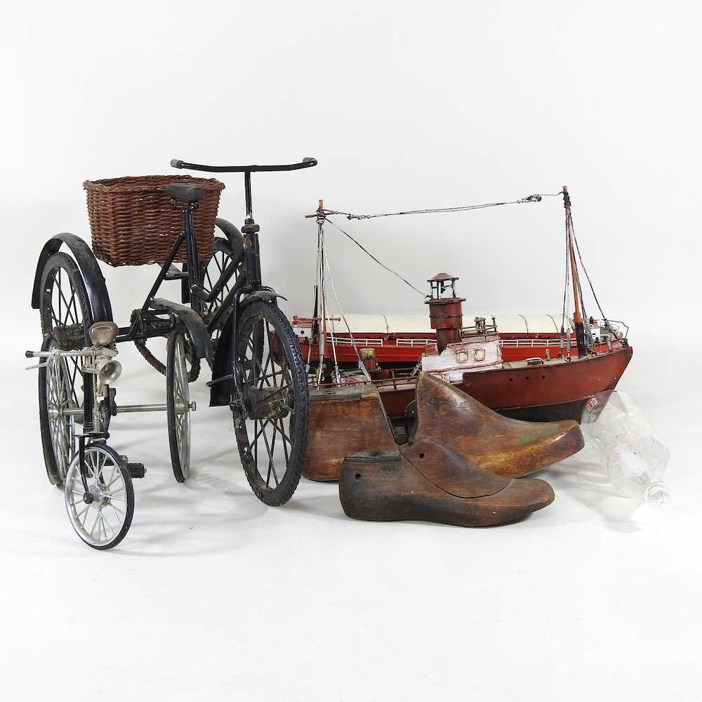 Lot 416 - A metal model of a vintage tricycle, 28cm,...