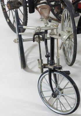 Lot 416 - A metal model of a vintage tricycle, 28cm,...