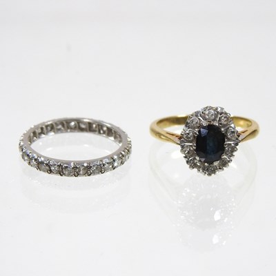 Lot 196 - A gold, sapphire and diamond cluster ring,...