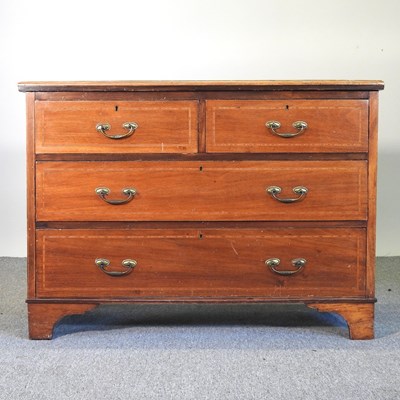 Lot 718 - An Edwardian inlaid chest of drawers, on...