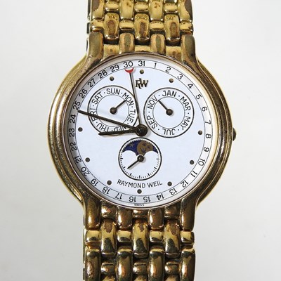 Lot 507 - A Raymond Weil 18 carat gold plated triple...