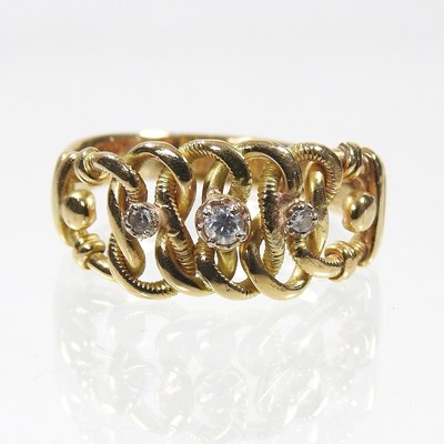 Lot 20 - An 18 carat gold diamond three stone ring, of...