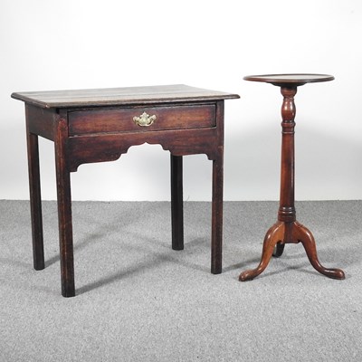 Lot 512 - An 18th century oak lowboy, with a shaped...