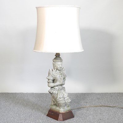 Lot 265 - An Eastern pottery figural table lamp and...