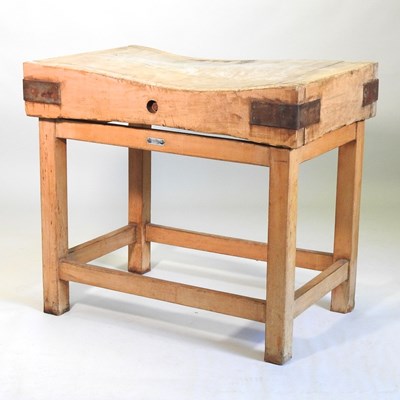 Lot 523 - A beech and pine butcher's block, on stand