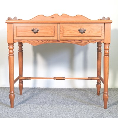 Lot 657 - A pine side table, with a gallery back and two...