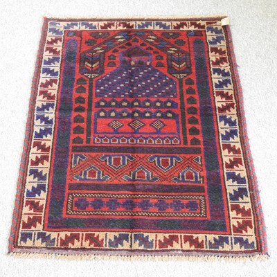 Lot 415 - A Baluchi prayer rug, of geometric design, 134...