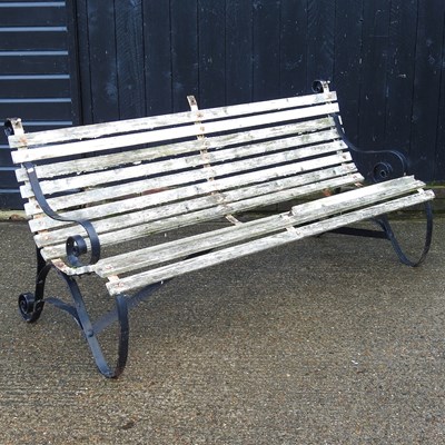 Lot 404 - A wooden garden bench, 186cm wide, with...