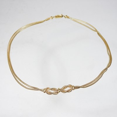 Lot 195 - A Unoaerre 18 carat gold necklace, of coiled...