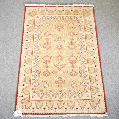 Lot 705 - A modern woollen rug, 200 x 134cm, retailed by...