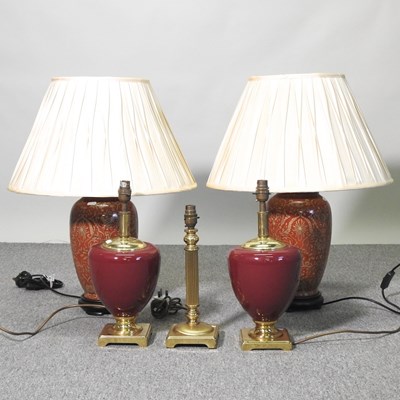 Lot 865 - A pair of red pottery table lamps and shades,...