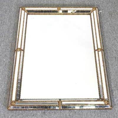 Lot 833 - An ornate gilt and glass framed wall mirror,...