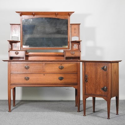 Lot 794 - An Arts and Crafts oak dressing table,...