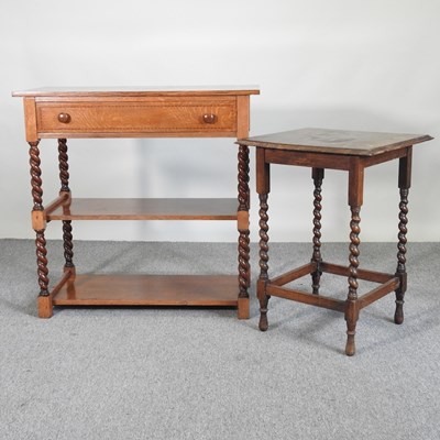 Lot 654 - A 1930's oak side table, on spirally turned...