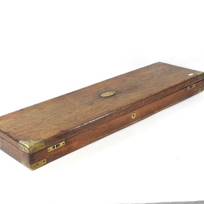 Lot 409 - A Victorian oak and brass mounted gun case,...