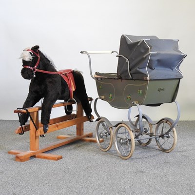 Lot 799 - A vintage doll's pram, together with a rocking...